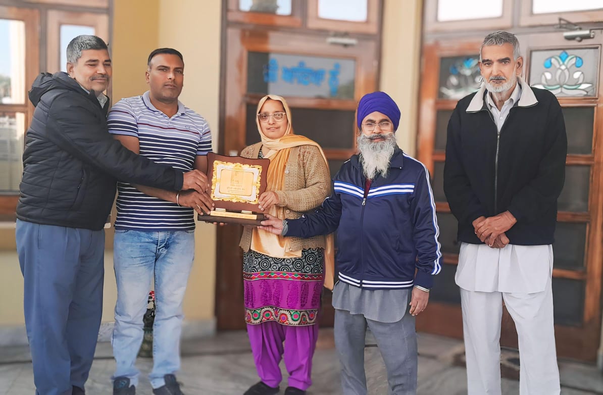 *Teacher honored for excellent services.*